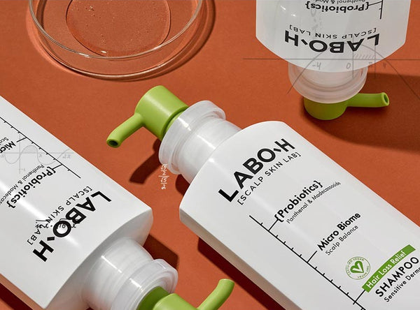 LABO.H skincare products on an orange background