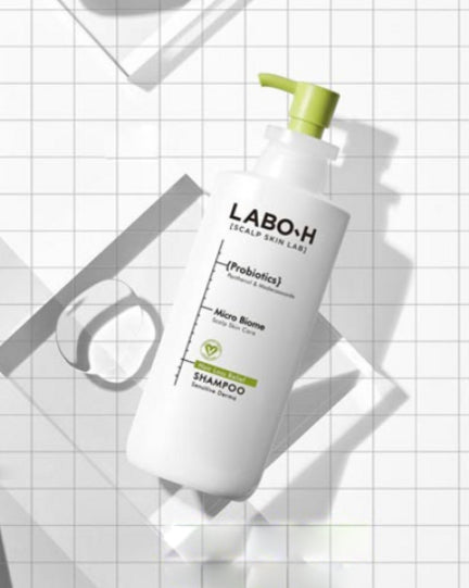 LABO-H shampoo bottle on a grid background