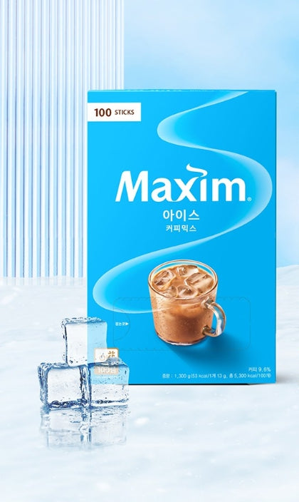 Maxim coffee sticks packaging with a glass of iced coffee and ice cubes on a light blue background