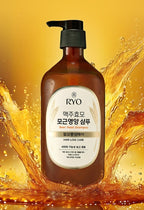 Bottle of RYO shampoo with a yellow background and water splash