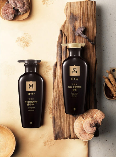 Two black bottles with 'RYO' branding on a wooden surface with natural elements.